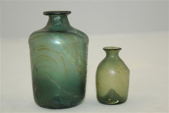 Two Roman glass bottles, c.2nd-4th century AD, 5.5 - 9.5cm